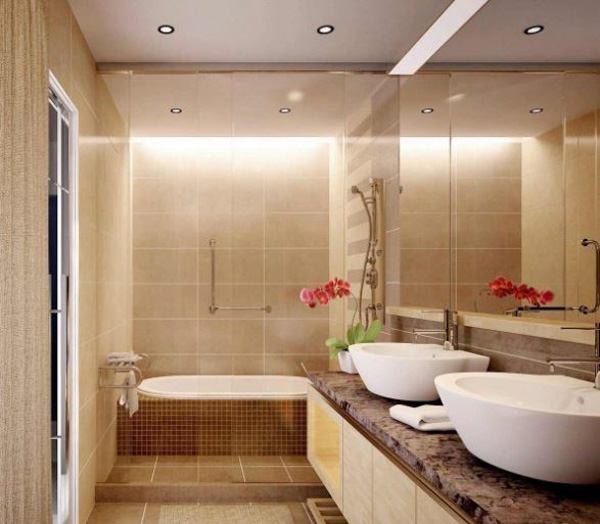 Phòng tắm sử dụng gam màu be nhẹ nhàng kết hợp với các phụ kiện màu vàng đồng tạo sự ấm cúng và sang trọng