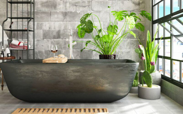 Phòng tắm sử dụng gam màu xanh lá cây nhẹ nhàng, kết hợp với cây xanh và đá tự nhiên tạo cảm giác thư giãn